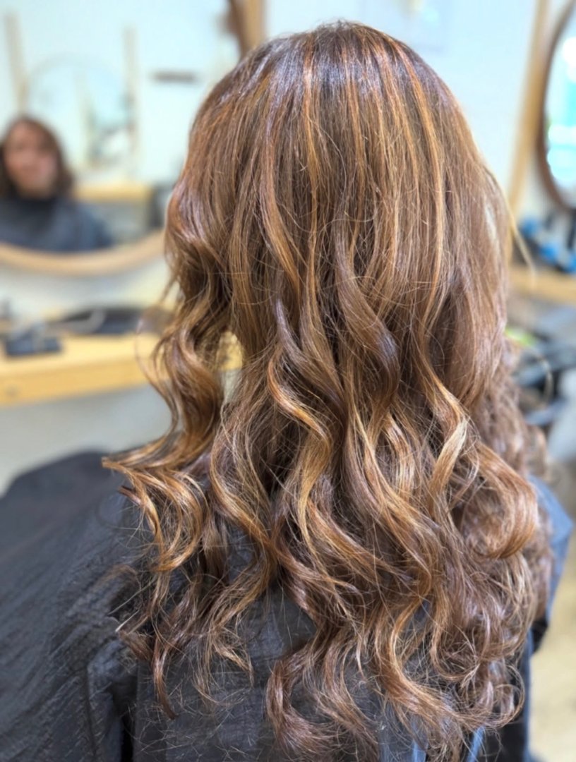 Long brunette with caramel highlights and soft waves